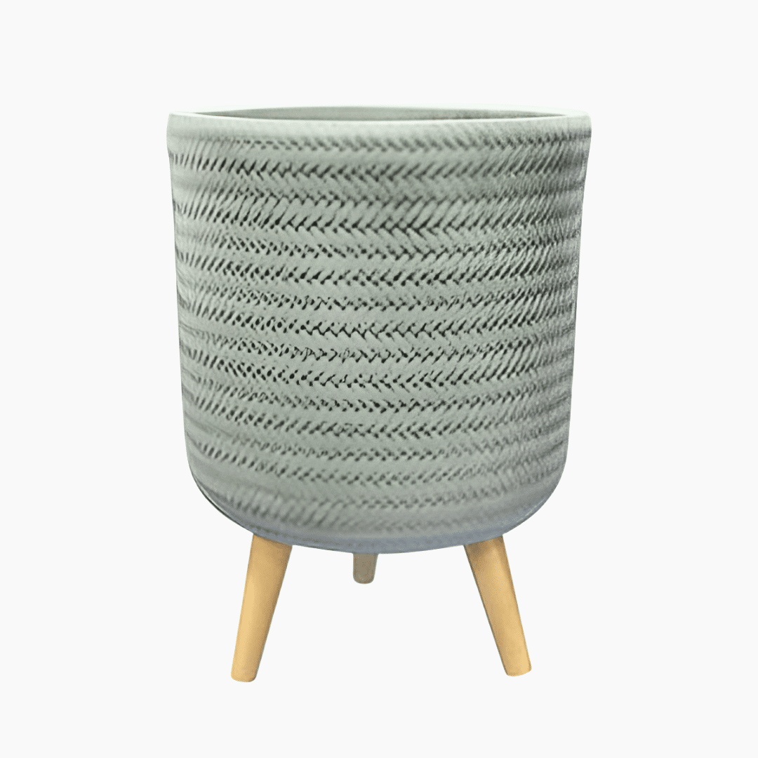 Fenne woven planter mint Fenne woven planter on legs in dry green and black, handcrafted from sustainable materials for indoor use