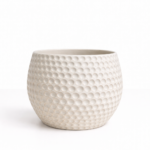 Large white ceramic planter with raised dimple texture against a white background.