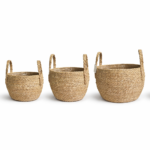 XLarge round natural seagrass woven basket with upright woven handles on white background.