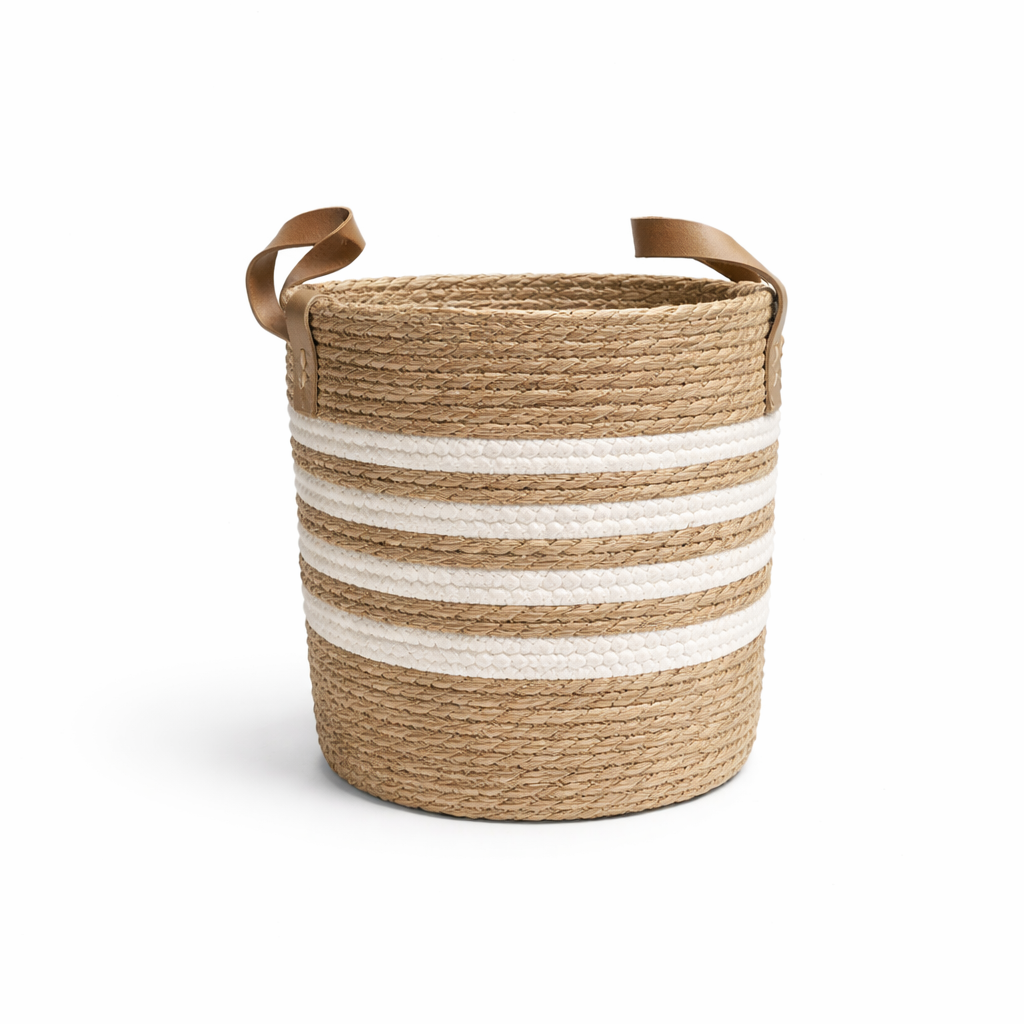 Seagrass white stripe Large natural seagrass woven basket with white horizontal stripes and brown handles on white background.