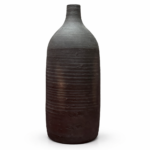 Textured charcoal clay vase with tall narrow neck and matte finish on white background
